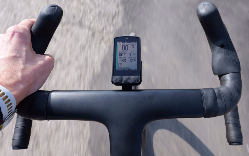 Wahoo ELEMNT BOLT V3 on a road bike handlebar showing a Strava Live Segment.