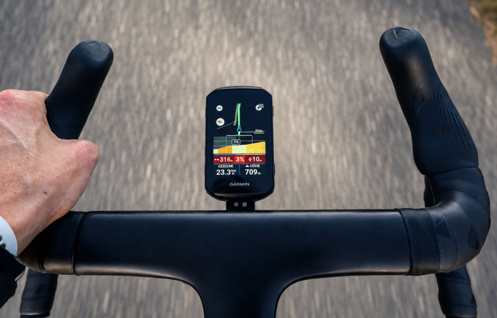 Garmin Edge 850 on a Road Bike Handlebar During a Ride with Navigation and Gradient Display