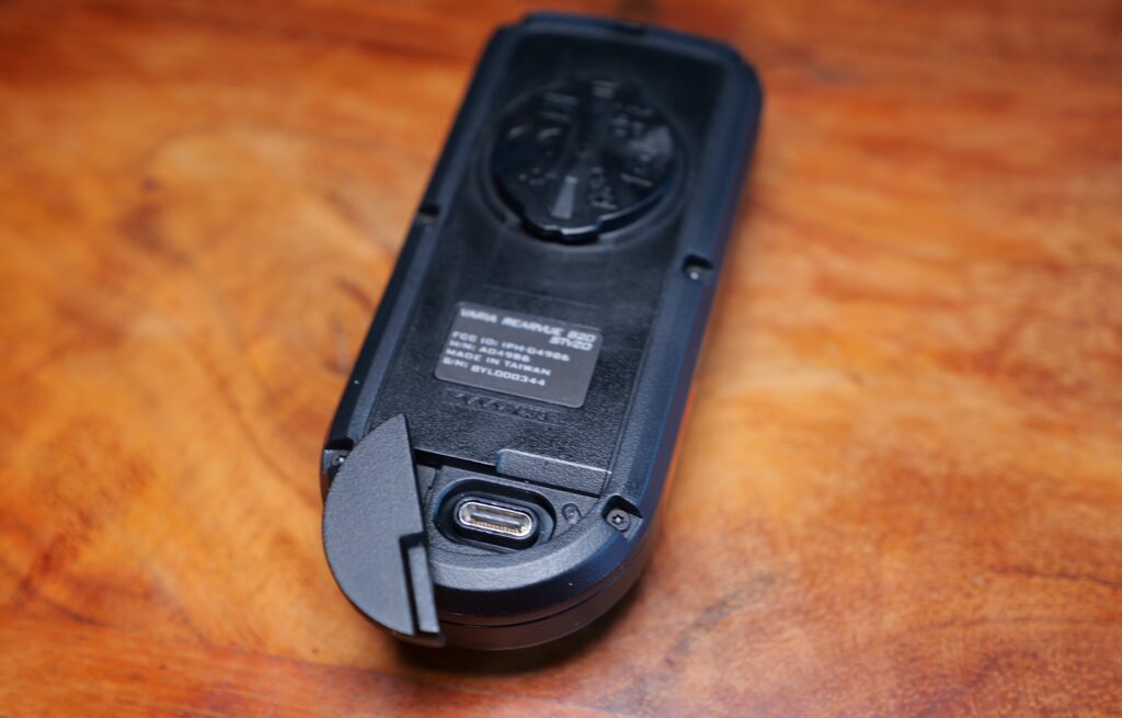 Rear of the Garmin RearVue 820 with Its Charging Cover Open and USB-C Port Visible.