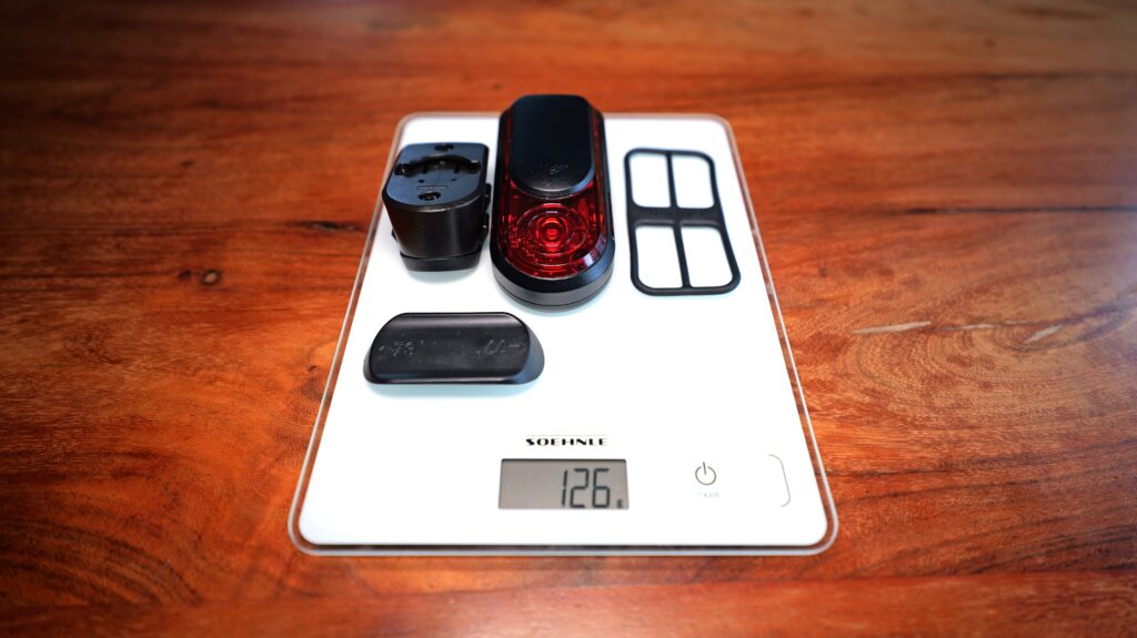 Garmin RearVue 820 with Mount, Rubber Insert and Cover on a Digital Scale, Total Weight 126 Grams.