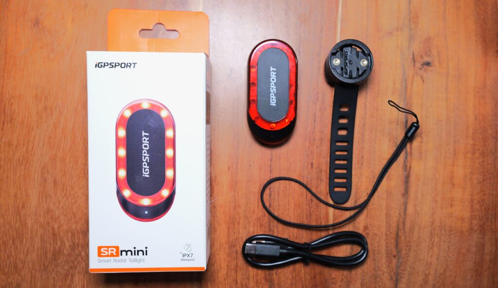 iGPSport SR Mini package contents: packaging, rear light, rubber strap mount, safety tether and USB charging cable.