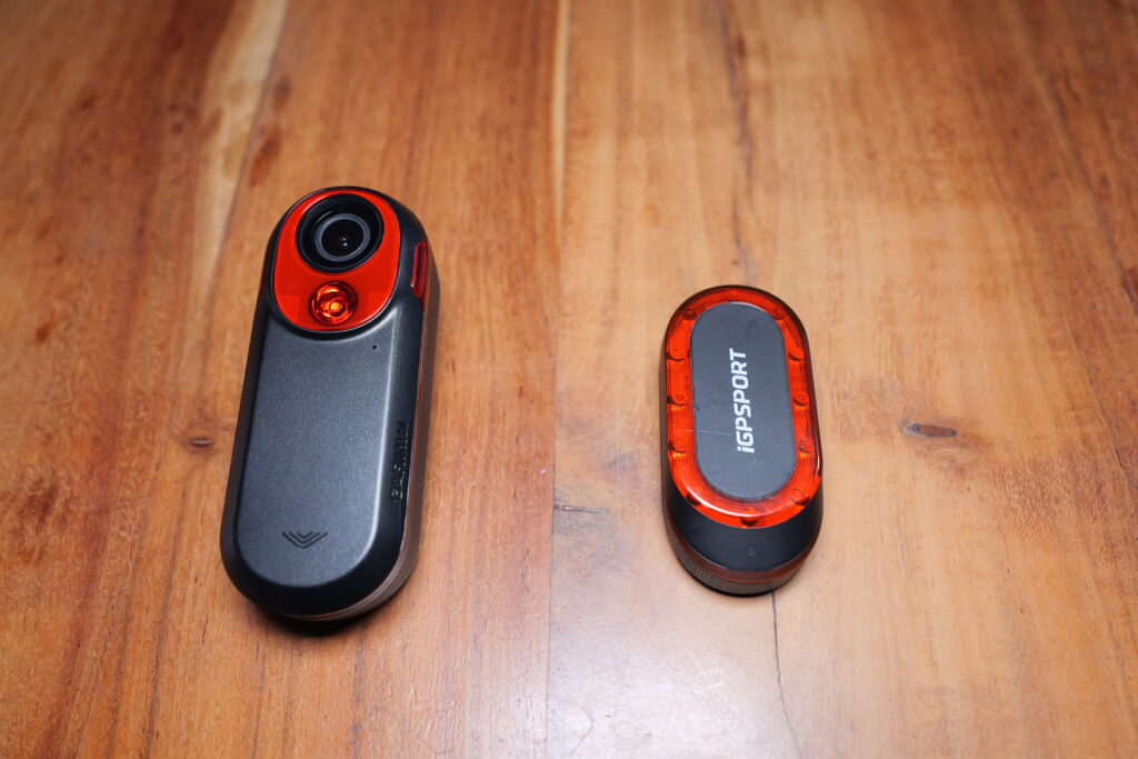 rct716.jpg iGPSPORT SR Mini beside the Garmin Varia RCT 716 in a direct size comparison.