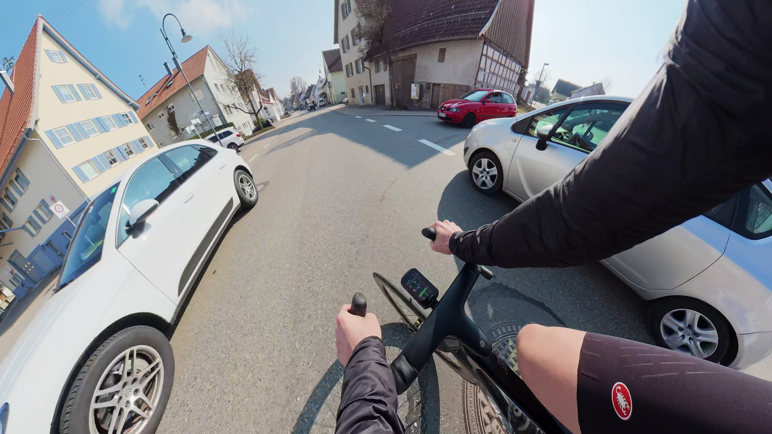 Road cyclist in traffic with a focus on safety
