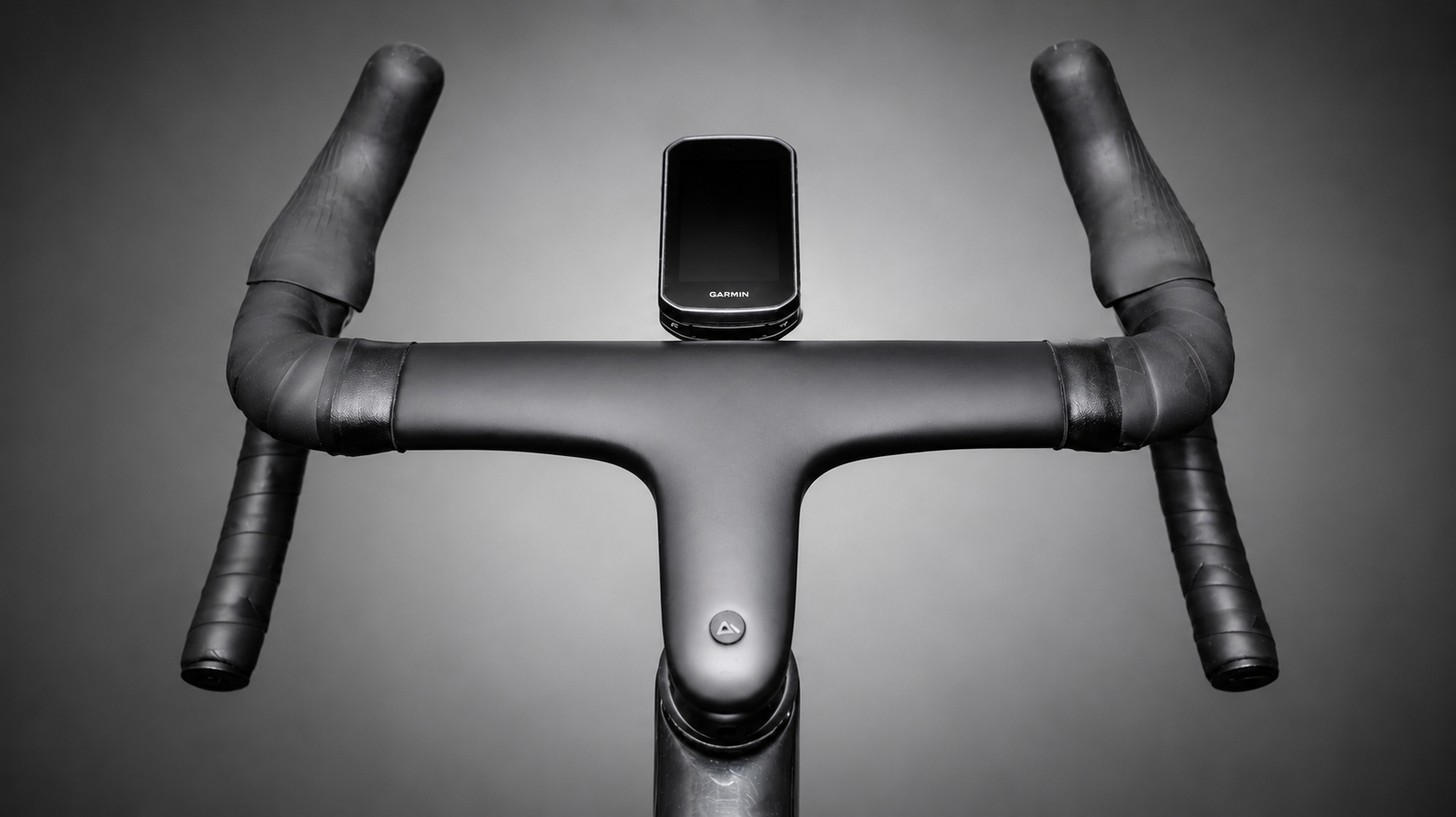 Road bike with drop handlebar and hoods illustrating reach, stem length and handlebar shape