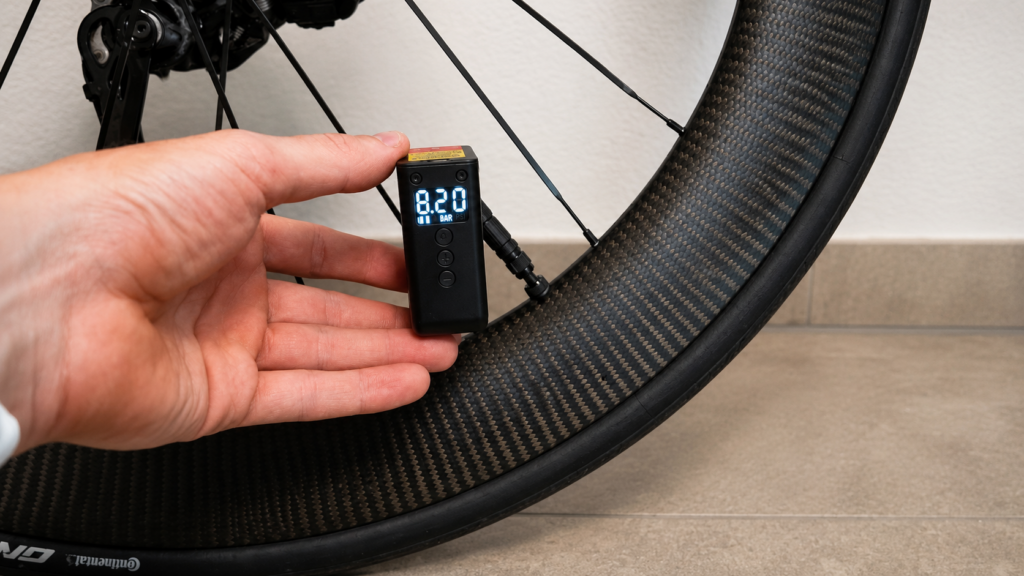 CYCPLUS AS2 Ultra on a road bike valve displaying 8.2 bar