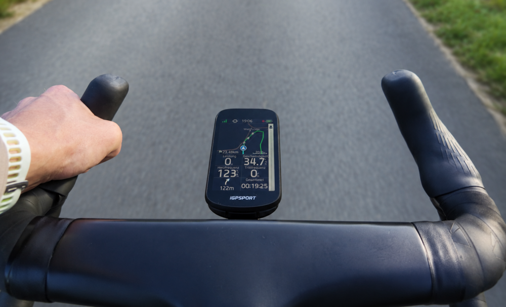 iGPSPORT BSC 500 showing a navigation map and ride data during a road ride