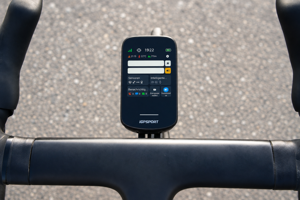 iGPSPORT BSC 500 on a road bike handlebar with the Display menu open in daylight