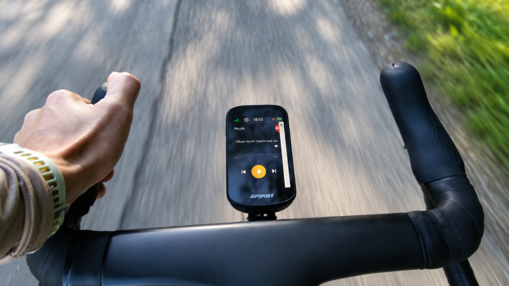 iGPSPORT BSC 500 with music controls during a road ride