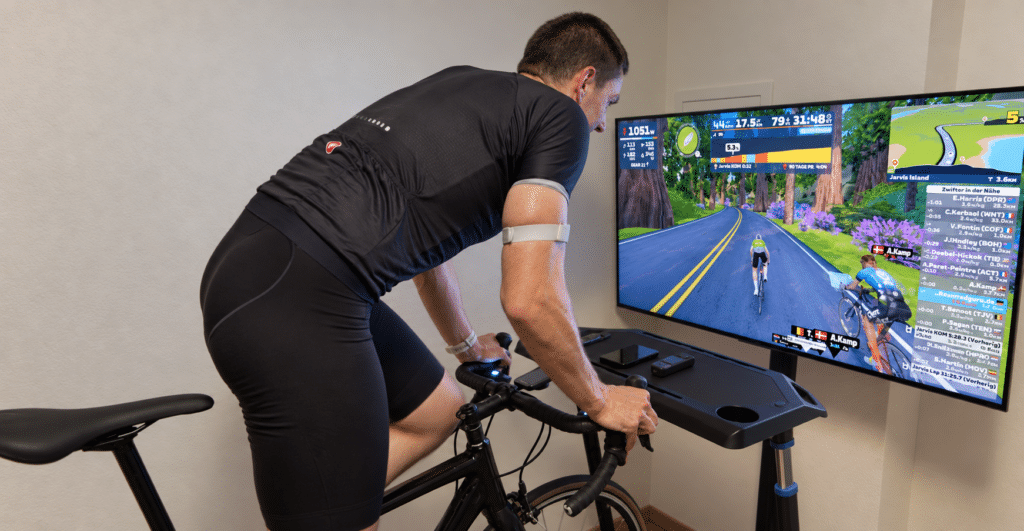 Cyclist Wearing an iGPSPORT HR80 on the Upper Arm During a Zwift Sprint